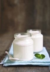 Obraz na płótnie Canvas Homemade yogurt in a glass jar.