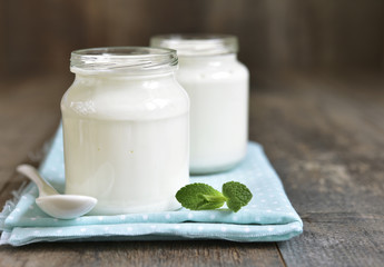 Homemade yogurt in a glass jar.