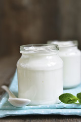 Homemade yogurt in a glass jar.