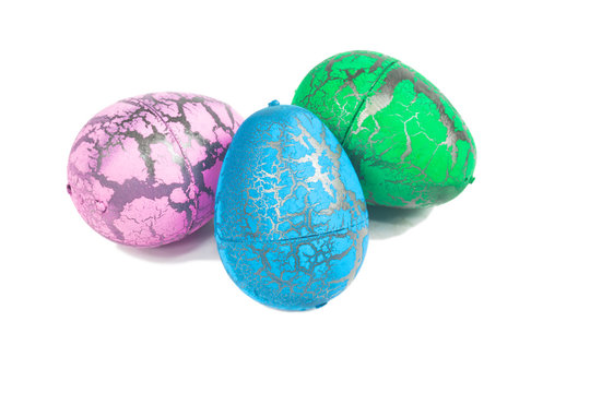 Toy Dinosaur egg for Easter isolate on white
