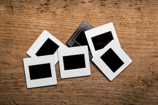Old slides on wood background