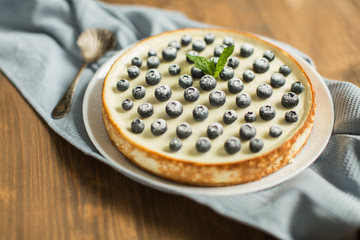 blueberry cheesecake on wooden table