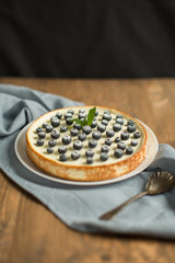 blueberry cheesecake on wooden table