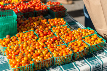 fresh cherry tomatoes for sale at a farmers market