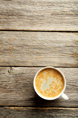 Cup of coffee on a grey wooden table