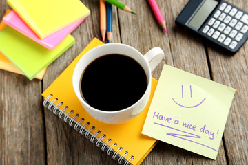 Piece of note paper on grey wooden background