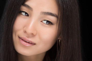 Fototapeta premium Close-up of face of Asian lady