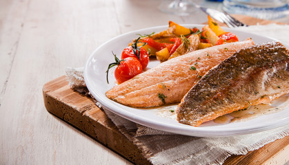 Two grilled salmon trout fillets