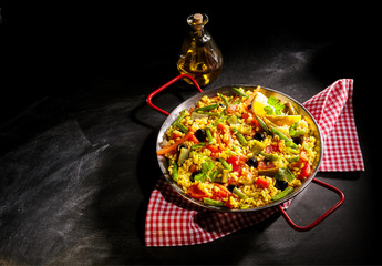 Vegetarian paella with asparagus and olives