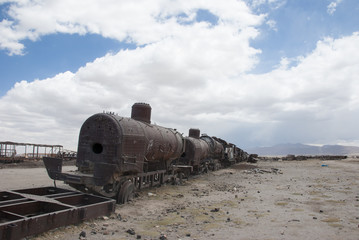 Fototapeta na wymiar Train Cemetery (Cementerio de Trenes) in Salar de Uyuni, Bolivia. 