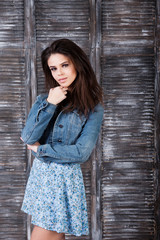 Fototapeta premium Beautiful young girl in blue dress