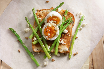 breakfast toast top with asparagus and soft boiled egg