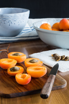 Halfs of apricots on cutting board. Selective focus.