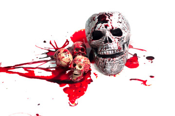 skull Conceptual image with blood on it resting on tiles on the floor