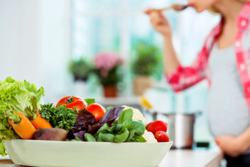 Young woman cooking in kitchen