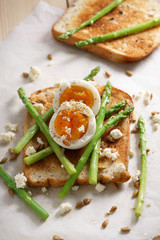 breakfast toast top with asparagus and soft boiled egg