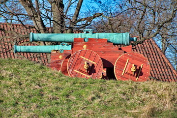 Old green cannons in a park