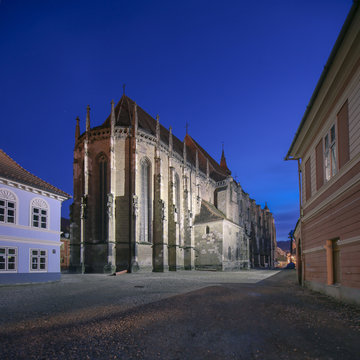 Brasov, Romania. Night image of the Black Church built in medieval times next to the Council Square in old city center of Brasov, Transylvania.