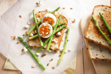 breakfast toast top with asparagus and soft boiled egg