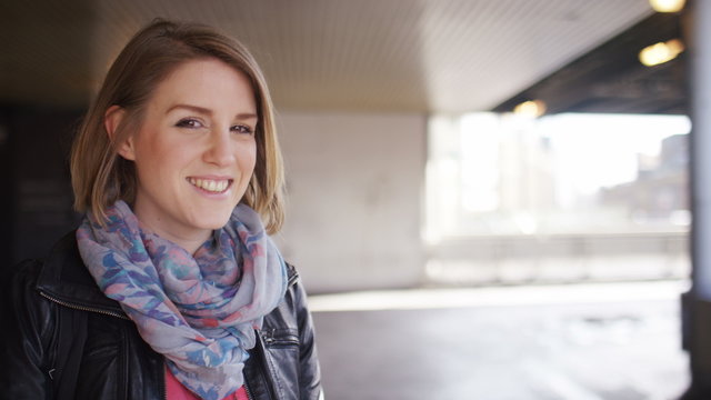 Portrait of attractive young woman smiling to camera