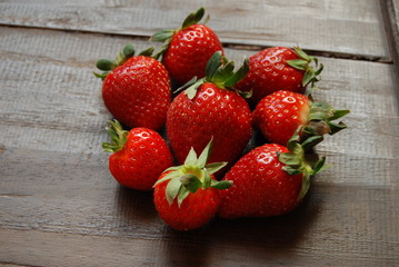 Red ripe strawberries in a heap, centered, close-up