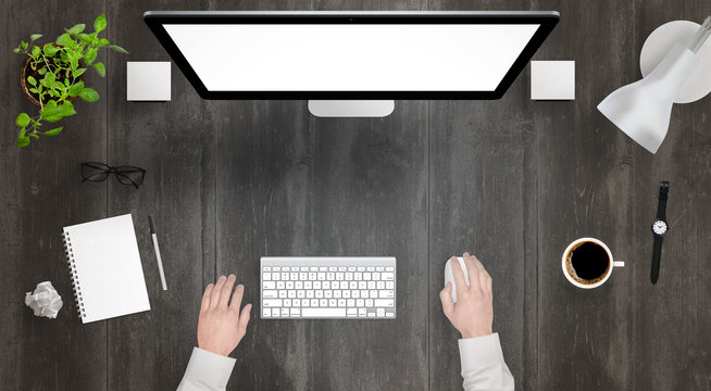 Modern Desk With Isolated Computer Display Top View. Designer Works With A Mouse And Keyboard. Coffee, Lamp, Paper, Glasses, Plant, Watch On Table.