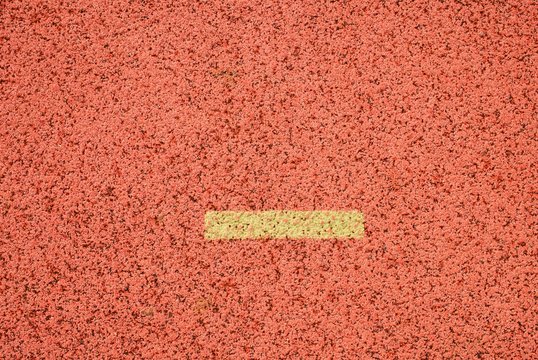 Yellow marks. White lines and texture of running racetrack, red racetracks in outdoor stadium