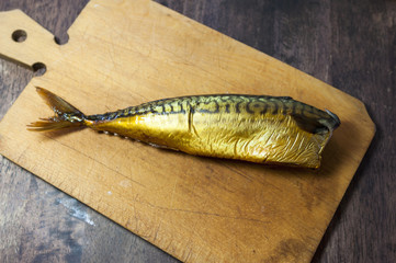 Smoked mackerel on kitchen background - studio shot