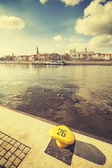 Retro stylized bollard by Szczecin waterfront, Poland