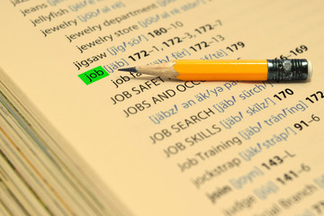 JOB - The words highlight in the book and pencil