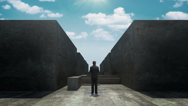Businessman front of maze and opened road concept