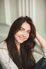 Portrait of a young lady in photostudio interior
