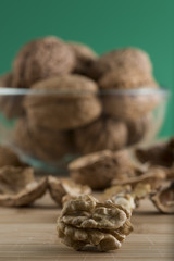 pile of walnuts in the foreground represent a healthy diet