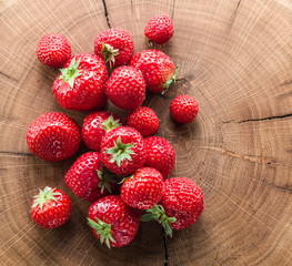 Strawberries on the old wooden board.