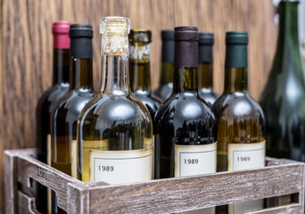 Wine bottles in a wooden crate .