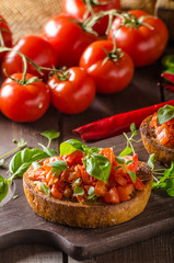 Italian bruschetta with roasted tomatoes and garlic