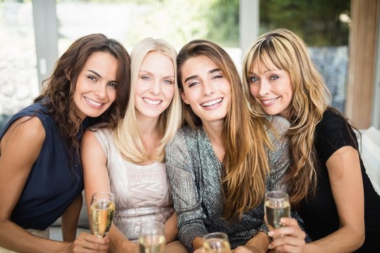 Fototapeta Portrait of beautiful women having drinks