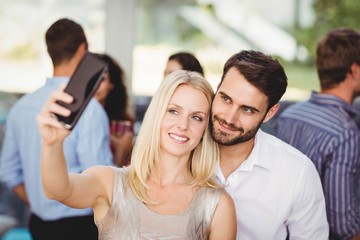 Young friends taking selfie