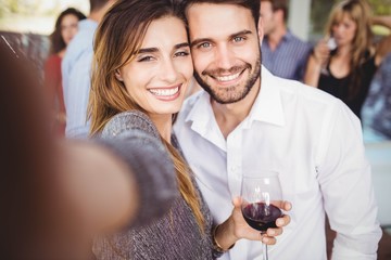 Young friends taking selfie