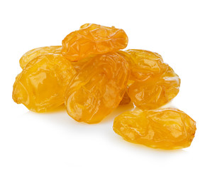 Yellow raisins close-up isolated on a white background.