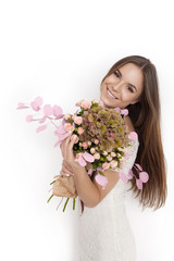 Young cute woman with spring flower bouquet