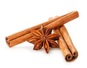Cinnamon stick and star anise spice close-up isolated on white background.