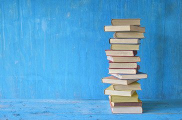 stack of books, grungy background, free copy space