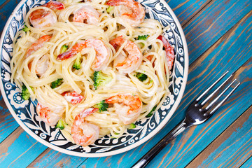 Creamy Shrimp and broccoli Spaghetti. View from above, top studio shot