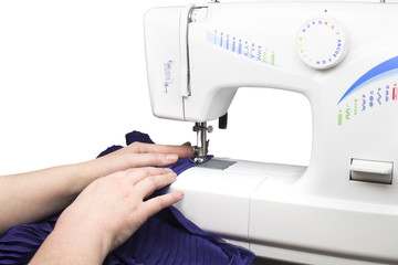 hands using sewing machine