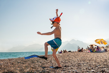 A child in flippers and snorkel