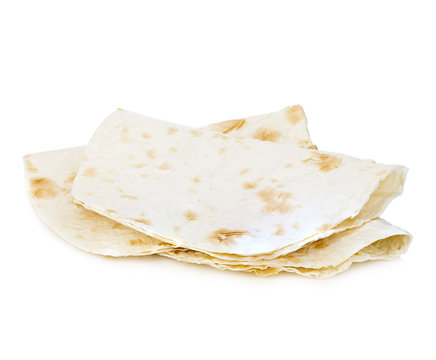 Wheat round tortillas close-up isolated on a white background. Lavash.