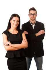 Confident business couple standing one behind the other as a sig