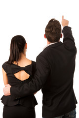 Confident business couple standing next to each other, pointing