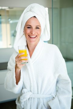 woman wearing a dressing gown and a towel 
